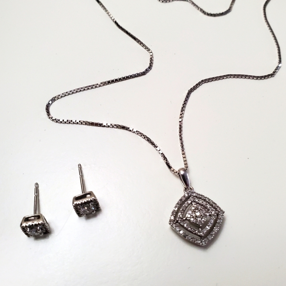 White gold 10k diamonds necklace and erring.